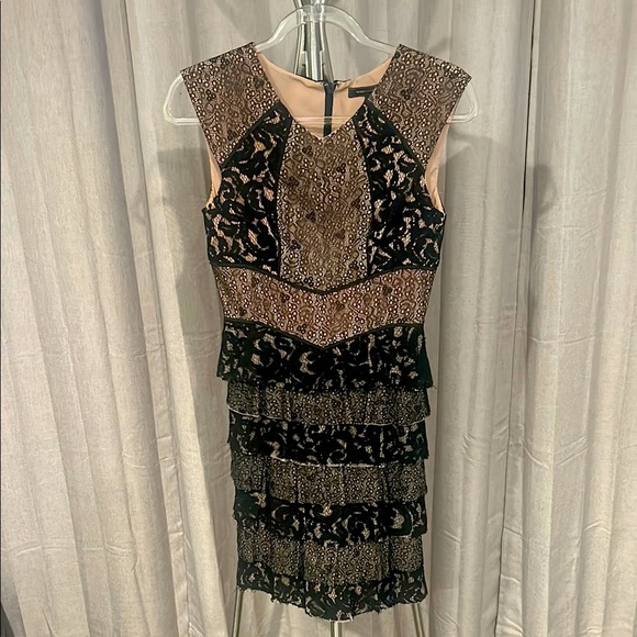 BCBGMaxAzria Black Sleeveless black lace tiered dress with tan underlay. - Picture 1 of 10